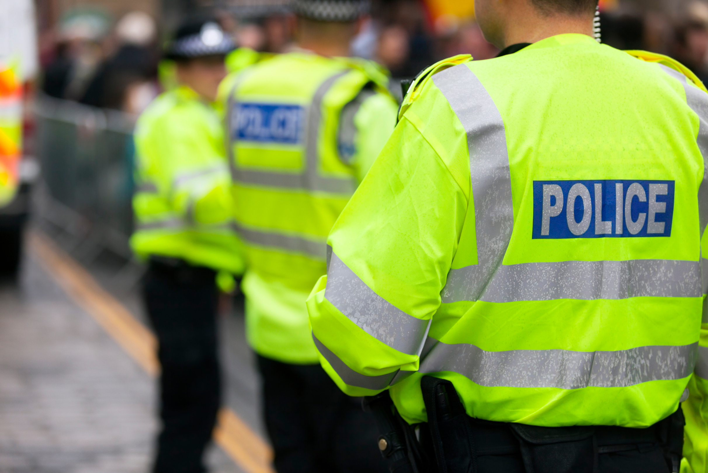 Police officers wearing high visibility jackets